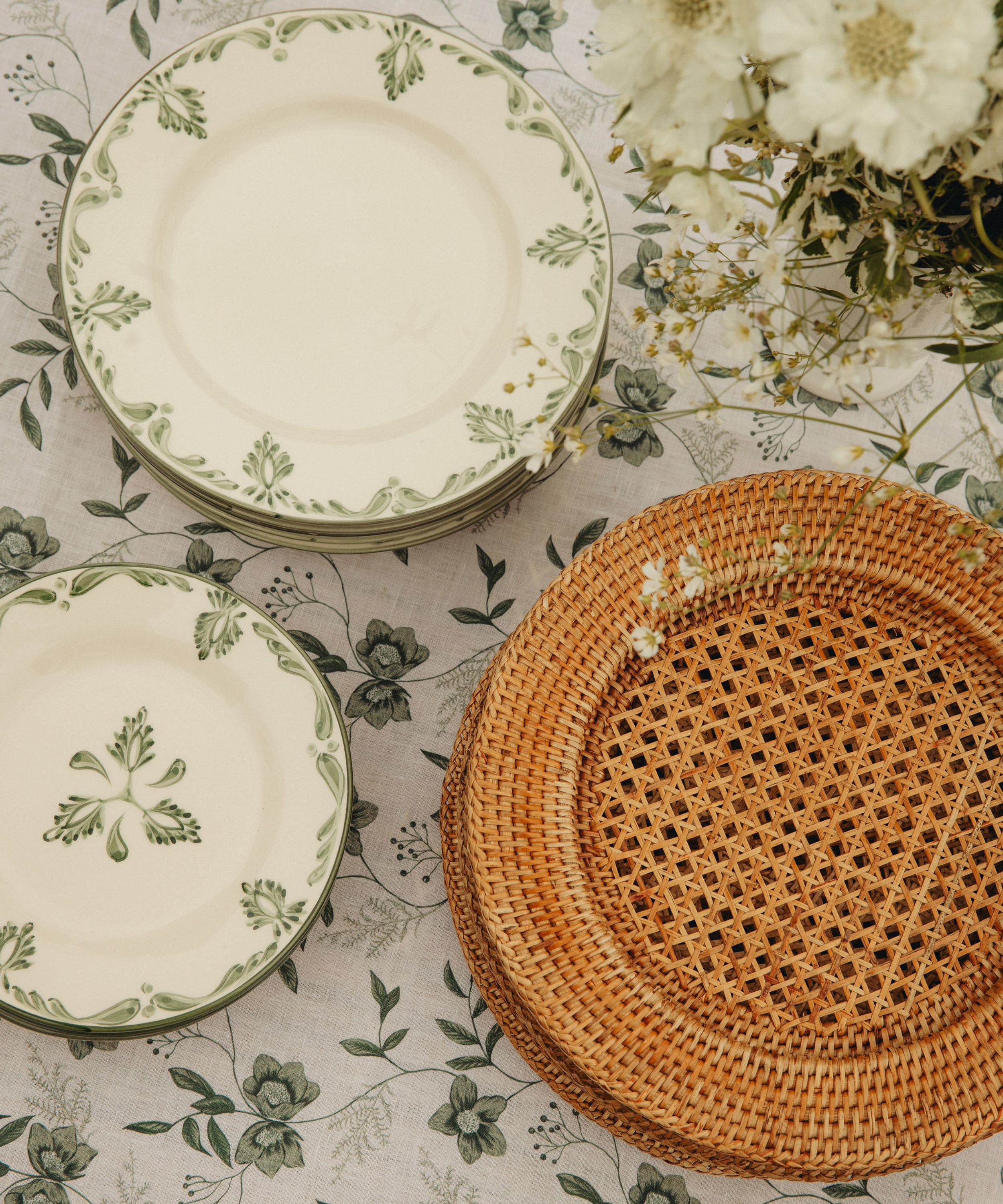 Rebecca Udall Rattan Charger, Natural with the Hellebore Tablecloth