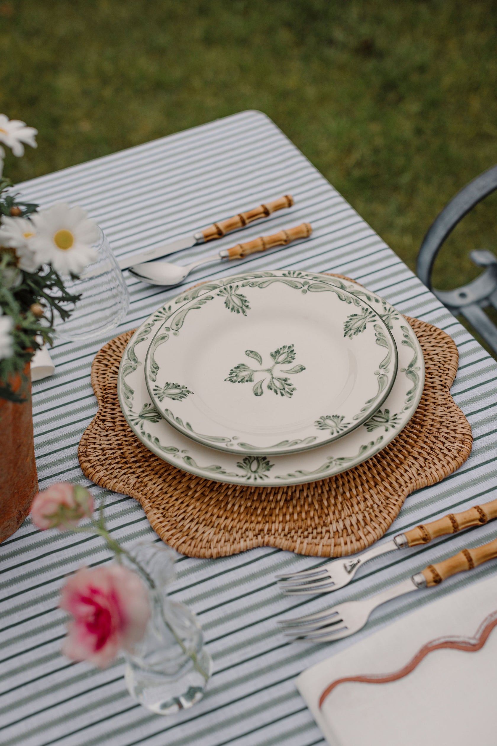 Rebecca Udall Victoria Striped Linen Tablecloth, Chalk & Moss Green with the Scalloped Rattan Charger