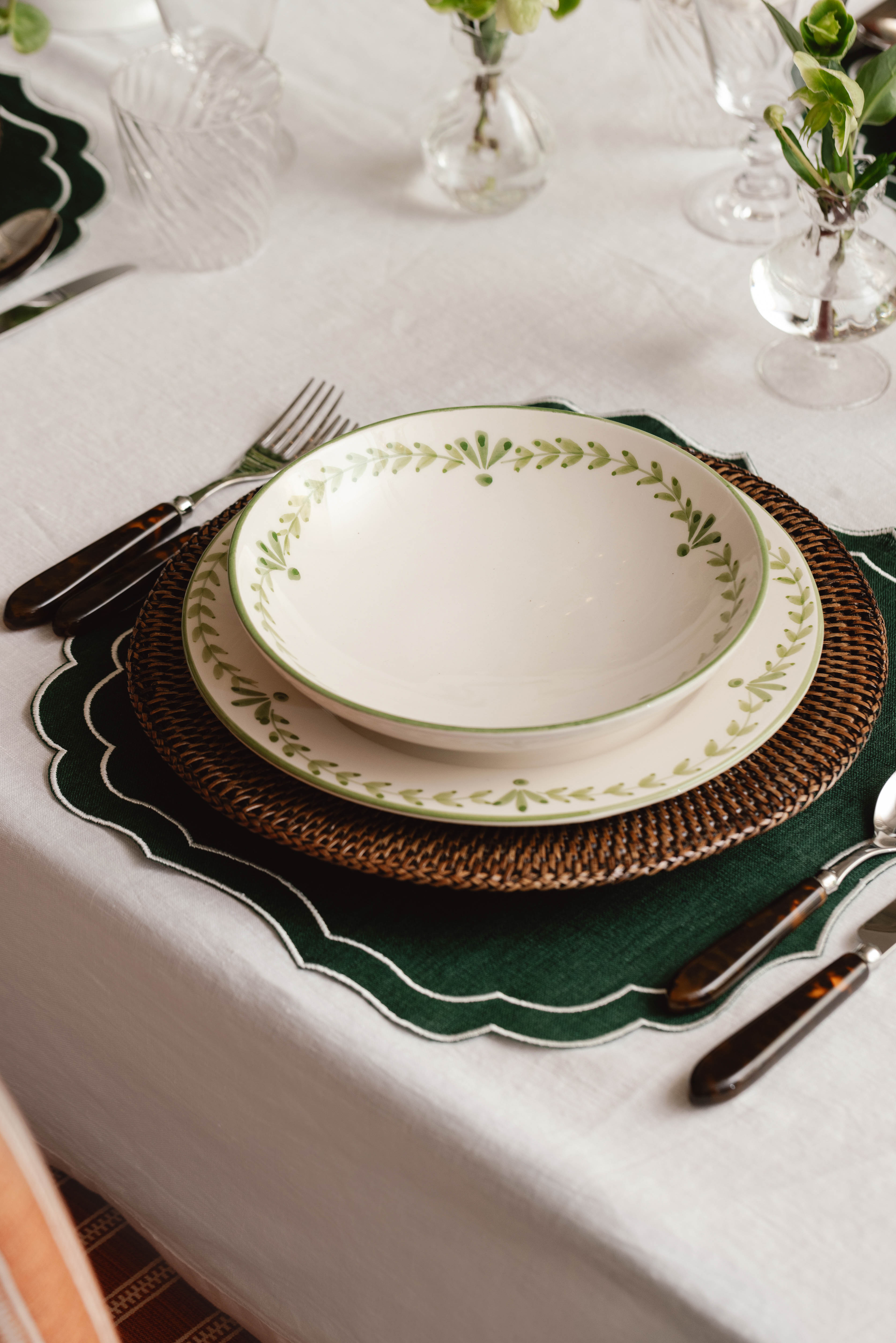 Rebecca Udall Hand Woven Rattan Charger, Brown with the Classic Hemstitch Tablecloth