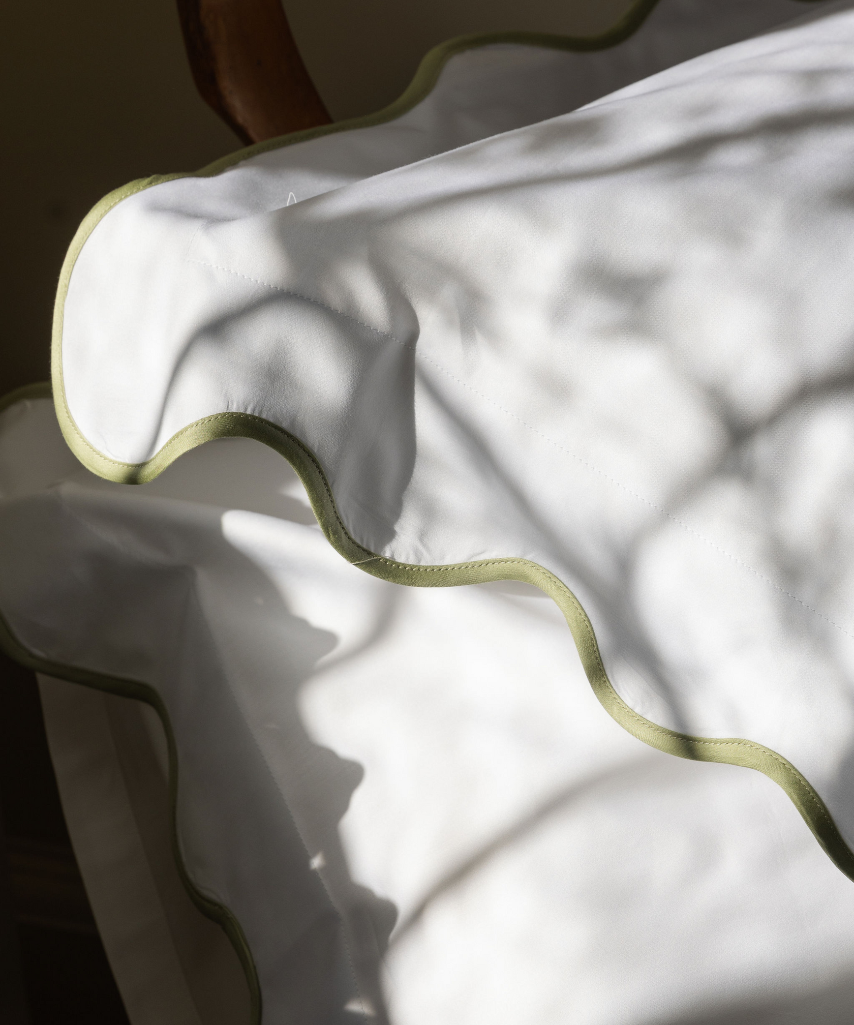 Rebecca Udall Scalloped Wavy Bed Linen, Sage Green Pillow Detail