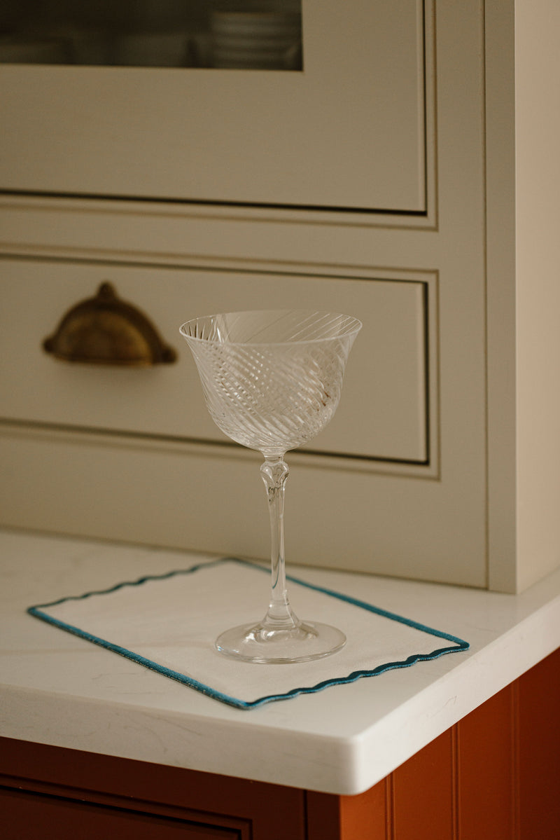 Rebecca Udall Julia Twisted Cut Crystal Coupe Glass with the Scalloped Linen Napkin