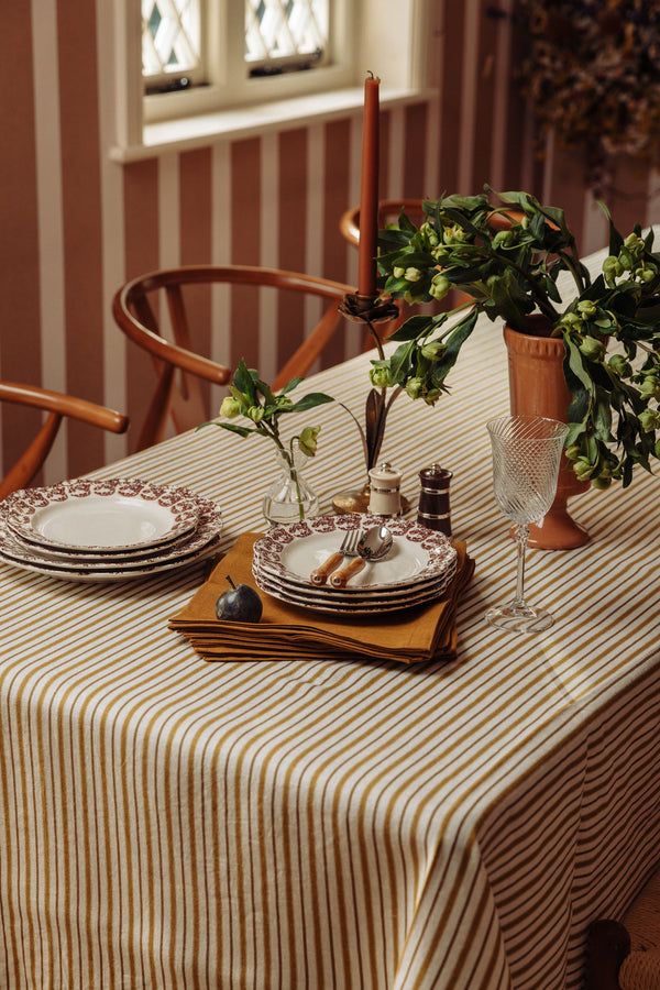 Rebecca Udall Victoria Striped Linen Tablecloth, Burnt Mustard, Lifestyle, with Terracotta Vase