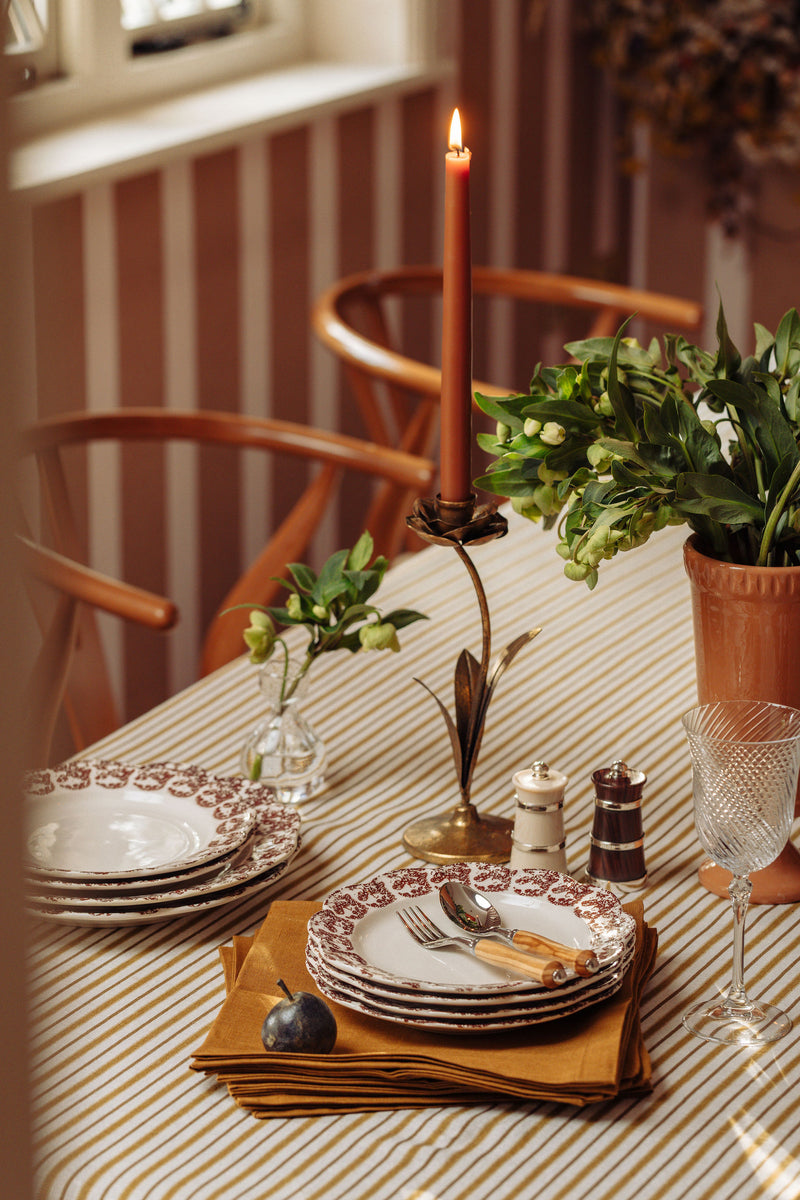 Rebecca Udall Victoria Striped Linen Tablecloth, Burnt Mustard, Lifestyle, with Hellebore Candleholder