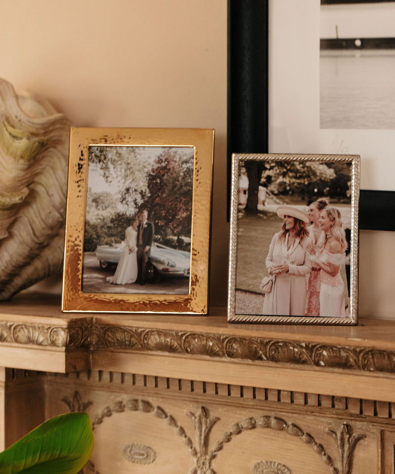 Rebecca Udall Gold Plated Hammered Photo Frame, Displayed Next to Sterling Silver Twist Photo Frame.