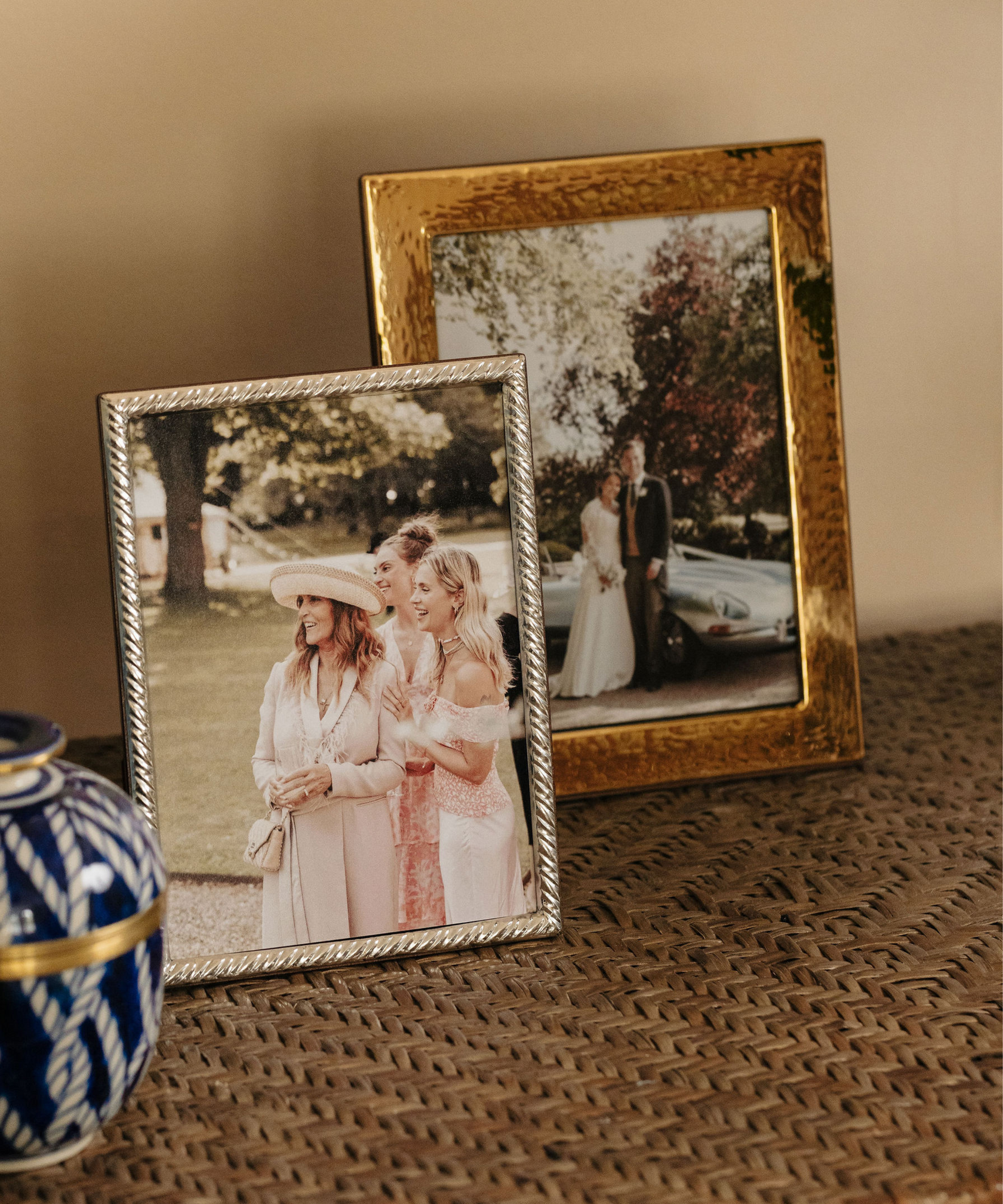 Rebecca Udall Gold Plated Hammered Photo Frame, Displayed on Shelf Next to Sterling Silver Twist Photo Frame. 