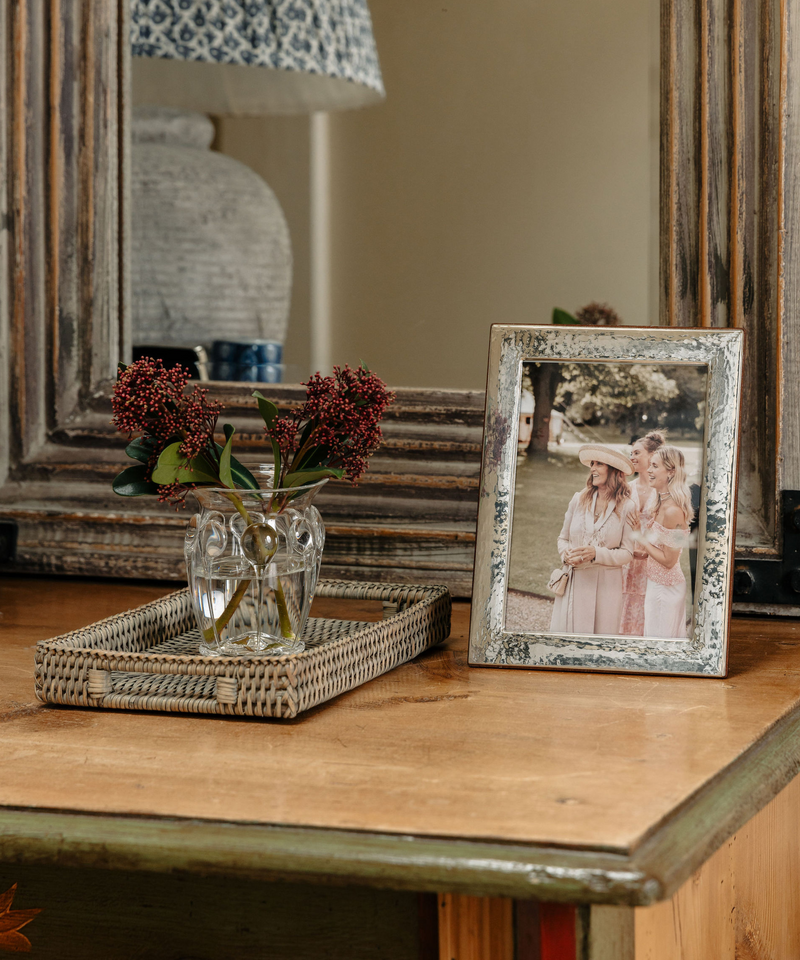 Rebecca Udall Sterling Silver Hammered Photo Frame, Displayed on Shelf in Front of a Mirror.