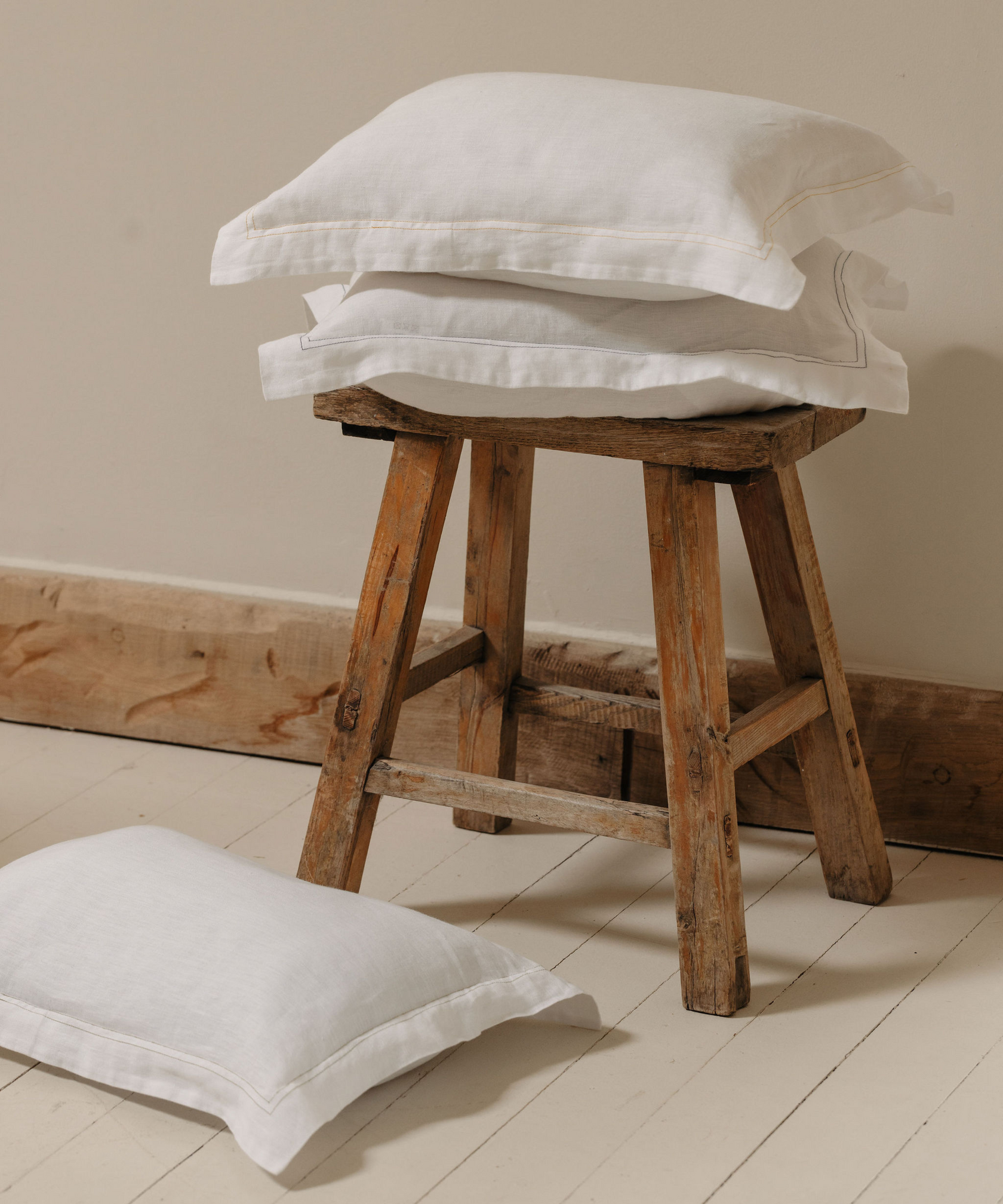 Rebecca Udall, Darcy Linen Boudoir Pillowcase with Stitch Detailing Trim on Wooden Stool