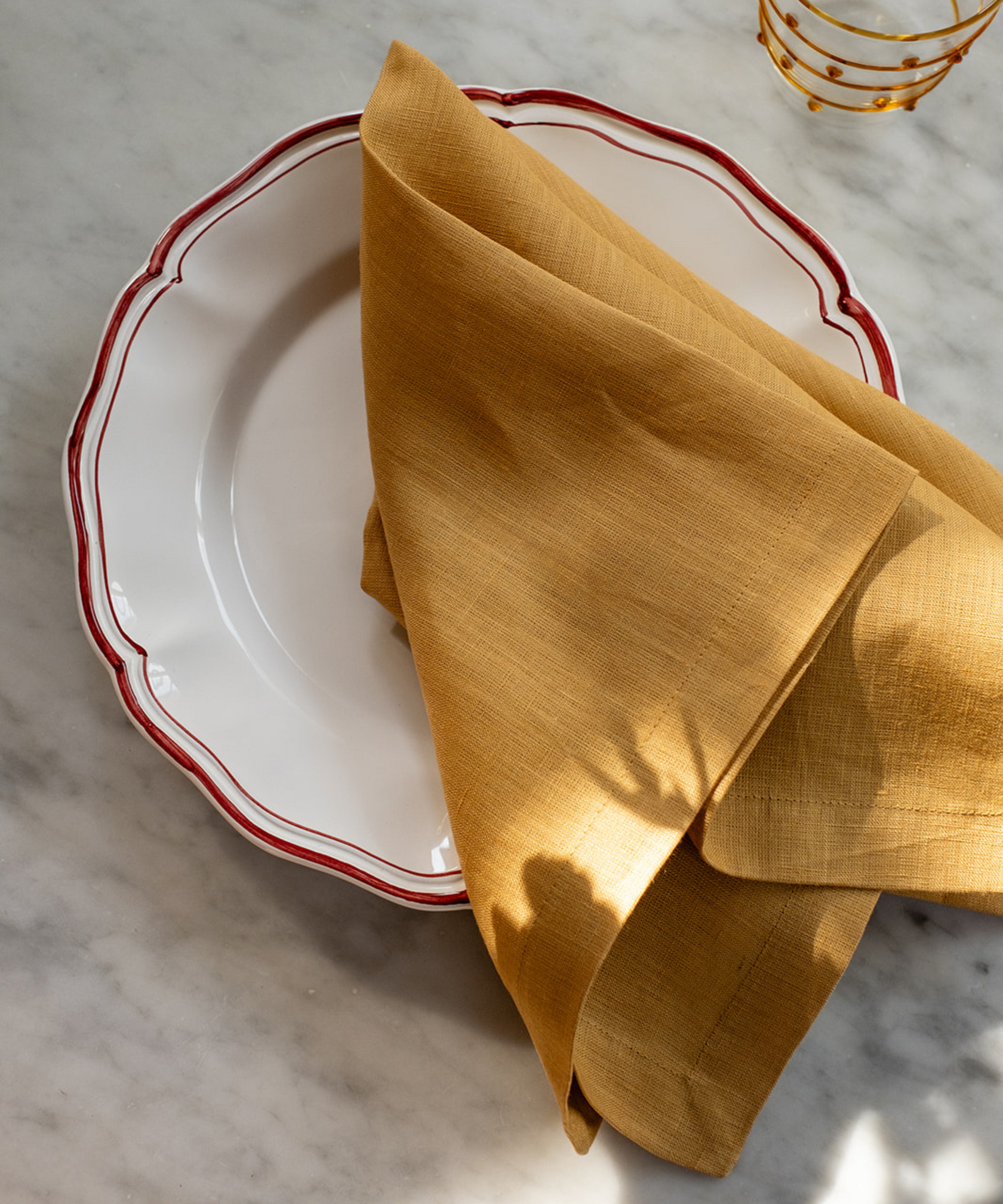 Zita Scalloped Crockery, Maroon Red, with Yellow Linen Napkin