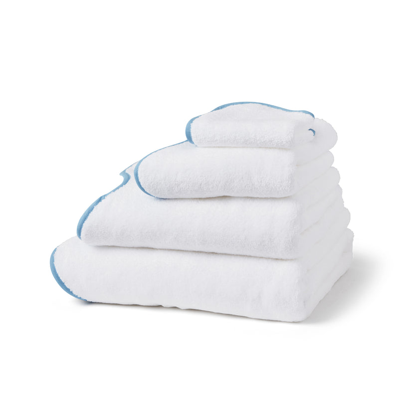 scalloped luxury portugese european cotton hand face bath towels sheets stack white sky blue