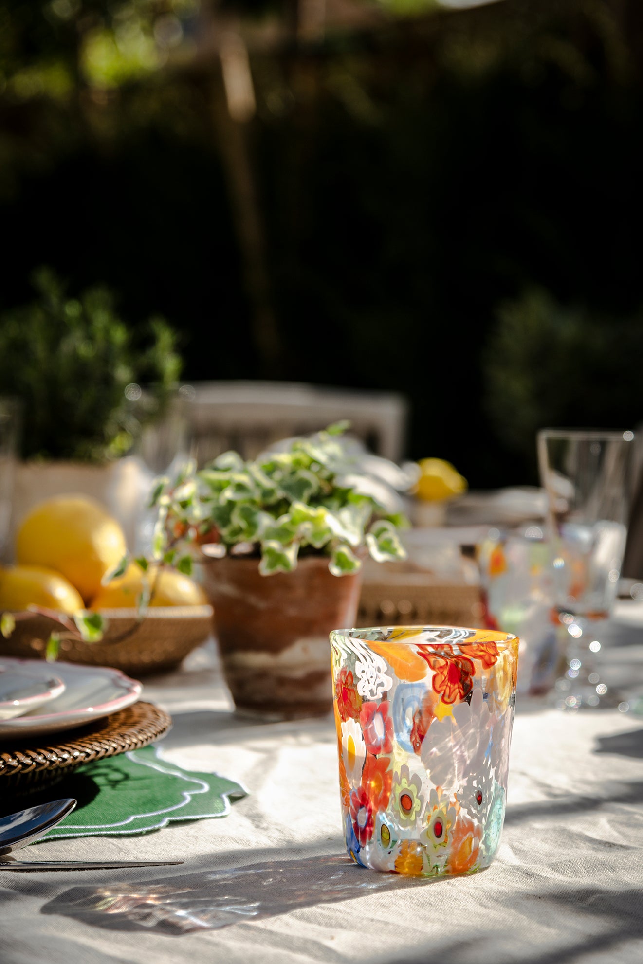 Rebecca Udall Millefiori Murano Glass Tumbler with the Rattan Charger